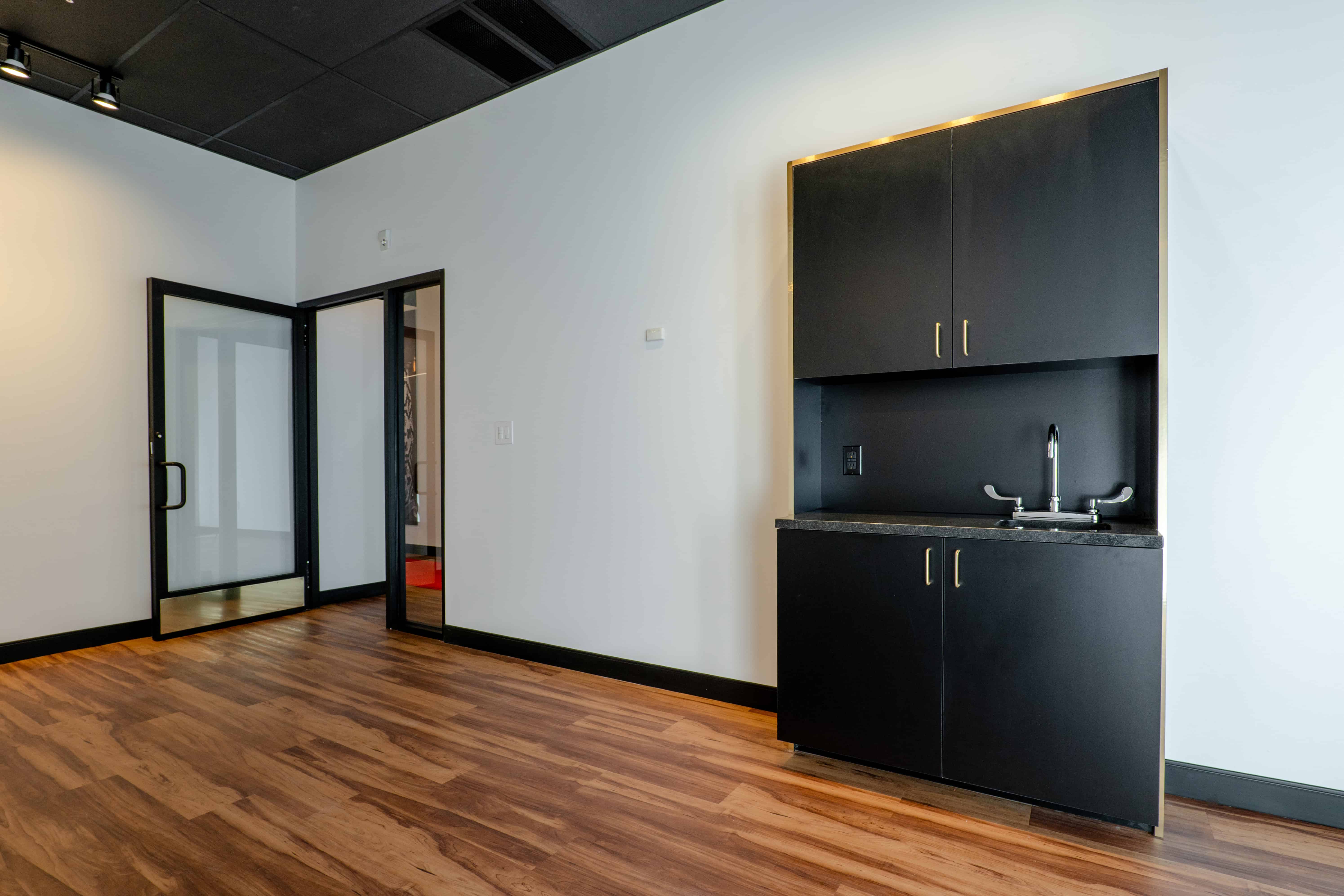 Empty Cosmo salon suite showing custom millwork
