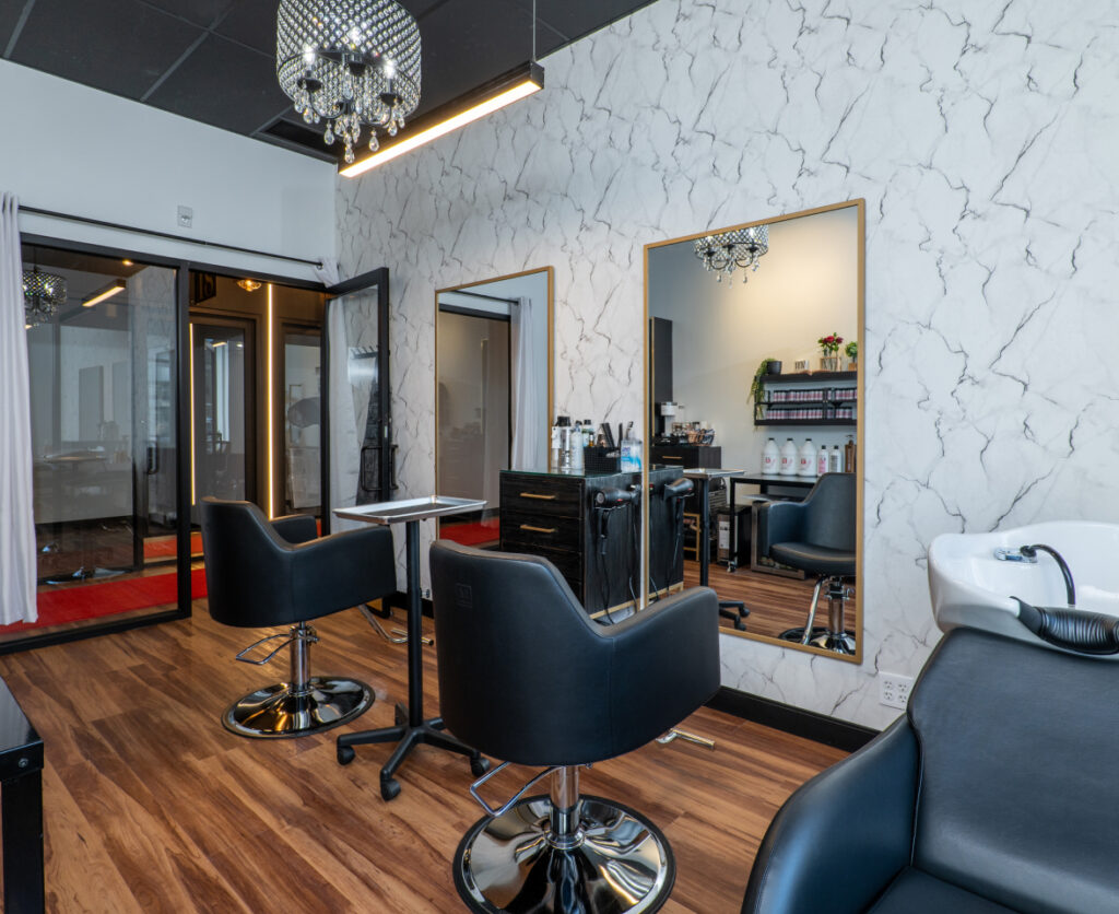 three chairs in empty salon suite